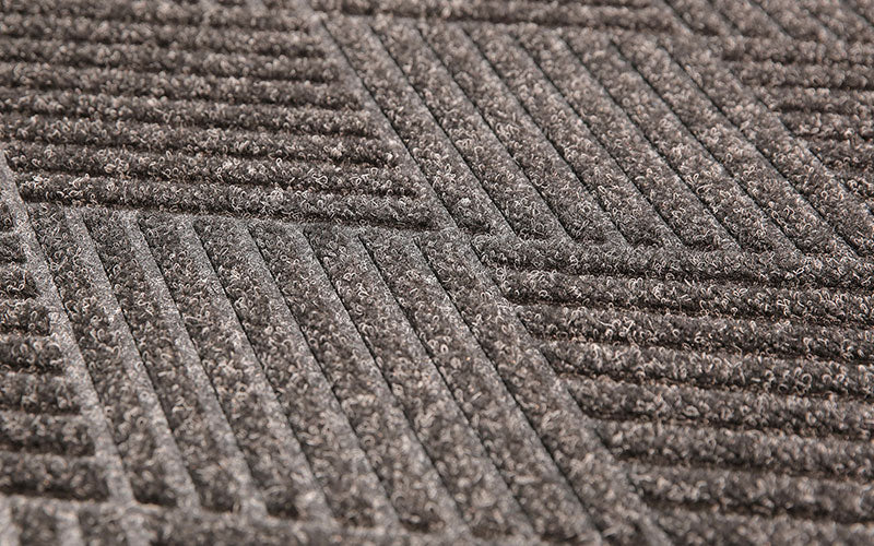 Close up image of the Charcoal diamond pattern which is stain and fade resistant. The Mat Group UK.