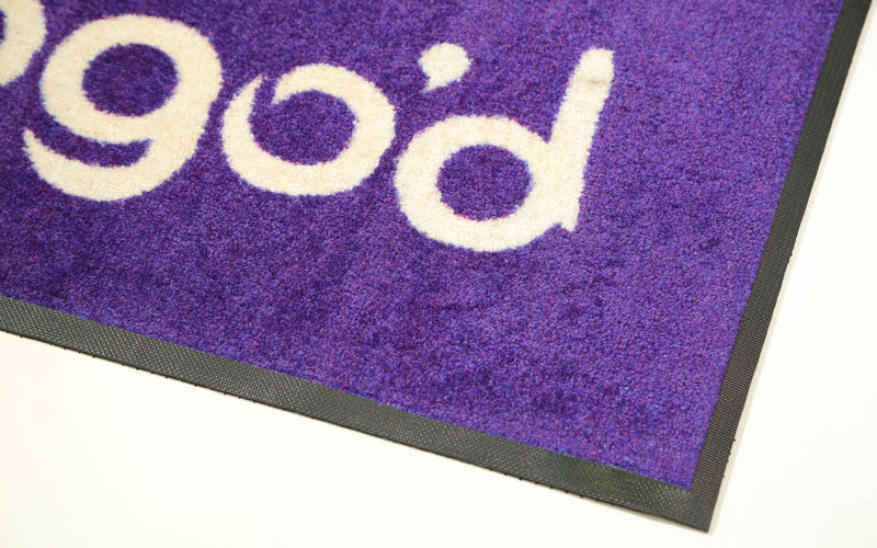 Corner product image of PrintPlush Logo Mat made from Plush nylon carpet top with nitrile rubber backing. The Mat Group UK.