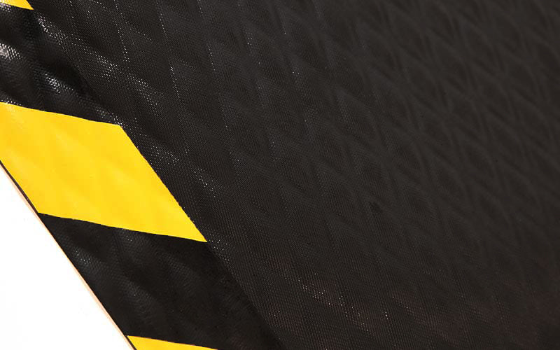 Close up image of the diamond pattern nitrile rubber surface of the Hog Heaven Mat with Chevron Safety Borders. The Mat Group UK.