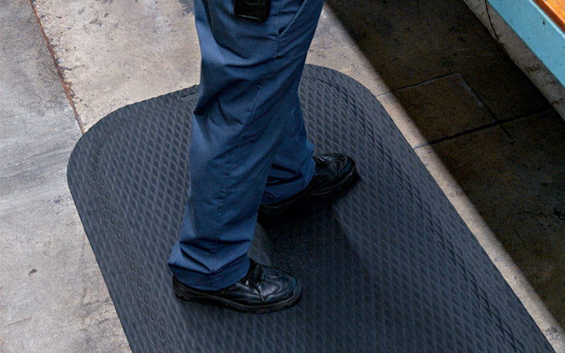 Insitu image of the Black Hog Heaven Impressions Mat at an assembly line to provide comfort to employees. The Mat Group UK.