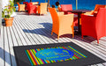 Insitu image of a Rubber Scraper Logo Mat as a beach club and restaurant. The Mat Group UK.