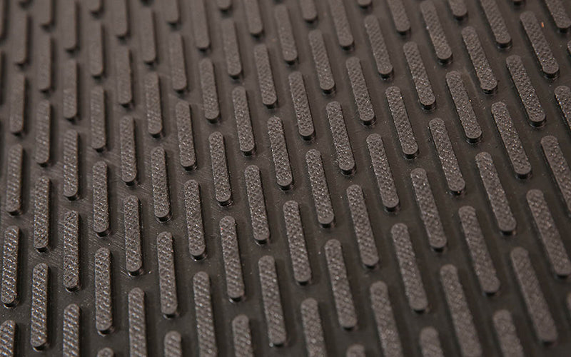 Close up image of the ScaperSafe cleated rubber pattern which is slip resistant and helps remove dirt and debris. The Mat Group UK.