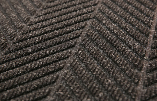 Close up image of the diagonal pattern of the Charcoal coloured Waterhog Eco Elite Fashion Mat. Suitable for indoor and outdoor entranceways. The Mat Group UK.