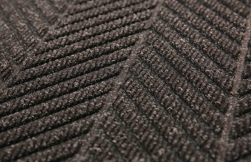 Close up image of the diagonal pattern of the Charcoal coloured Waterhog Eco Elite Mat. Suitable for indoor and outdoor entranceways. The Mat Group UK.