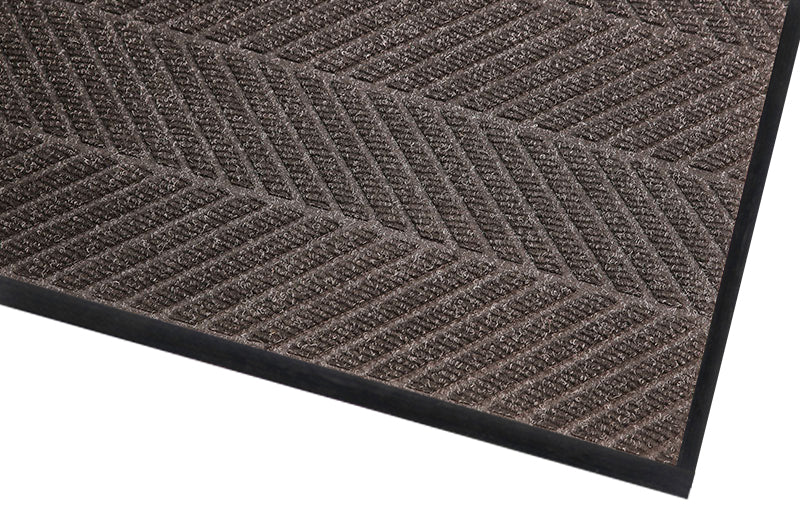 Corner image of the Charcoal Waterhog Eco Elite mat with rubber edges and backing which will are suitable for wet and dry entraceways. The Mat Group UK.