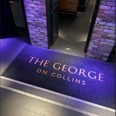 Insitu product image of PrintPlush Logo Mat for The George on Collins Restaurant entrance. The Mat Group UK.