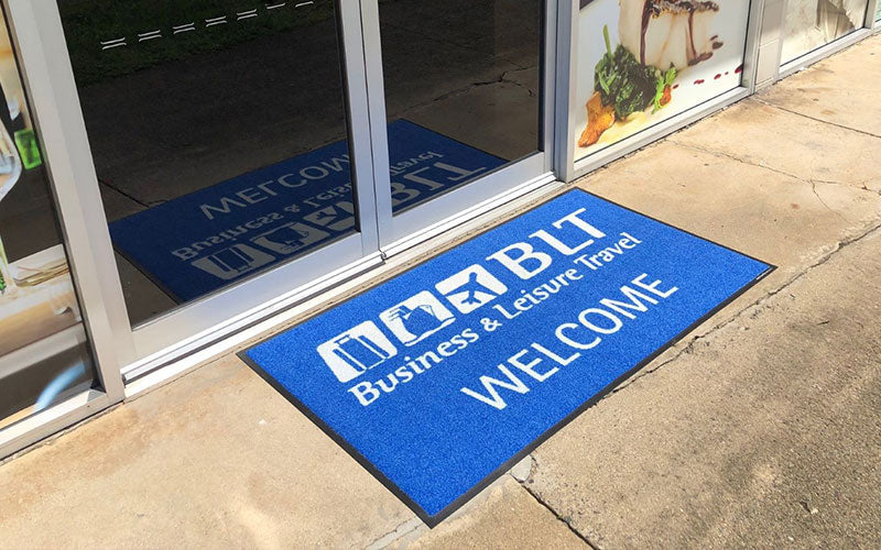 Insitu product image of PrintScraper Logo Mat at travel business entrance. The Mat Group UK.